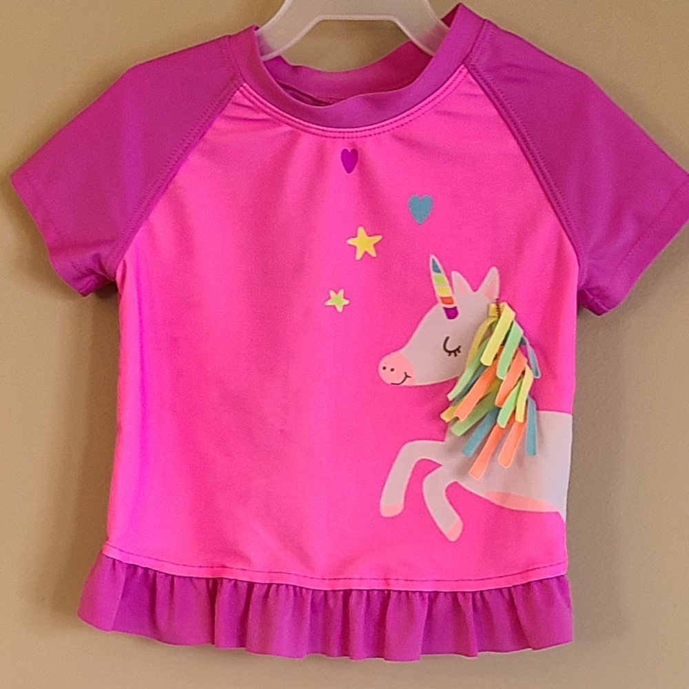 Bright pink rashguard unicorn swimsuit top
